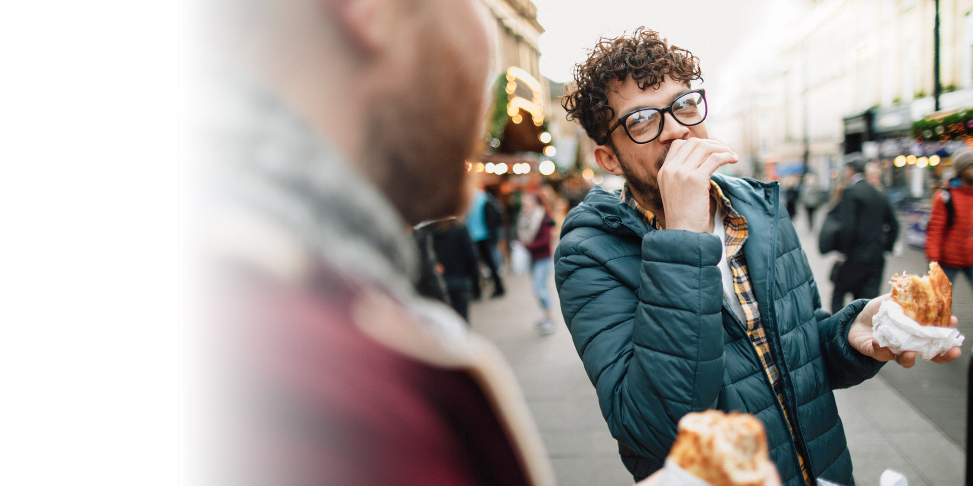 Two people outside eating